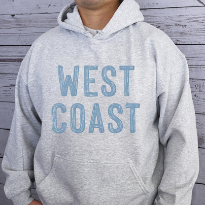 West Coast design that appears painted onto a gray hooded sweatshirt.